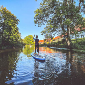 Person Paddle Boards in Eco-Odyssee Water Maze near Wakefield Quebec